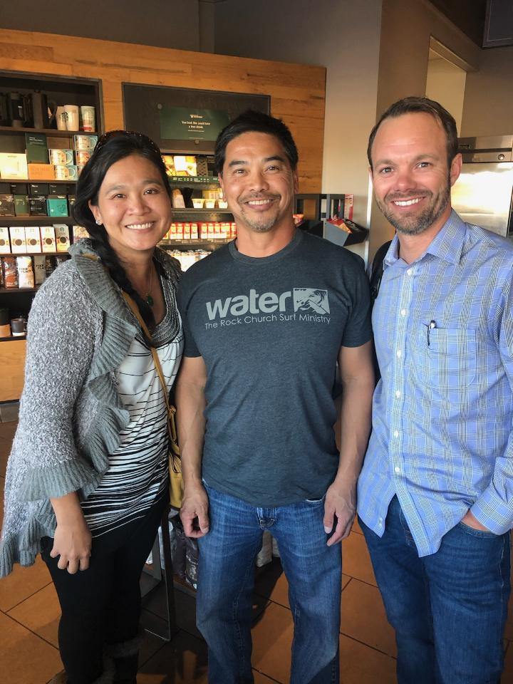 All three founders smile at the camera after having a business meeting at Starbucks